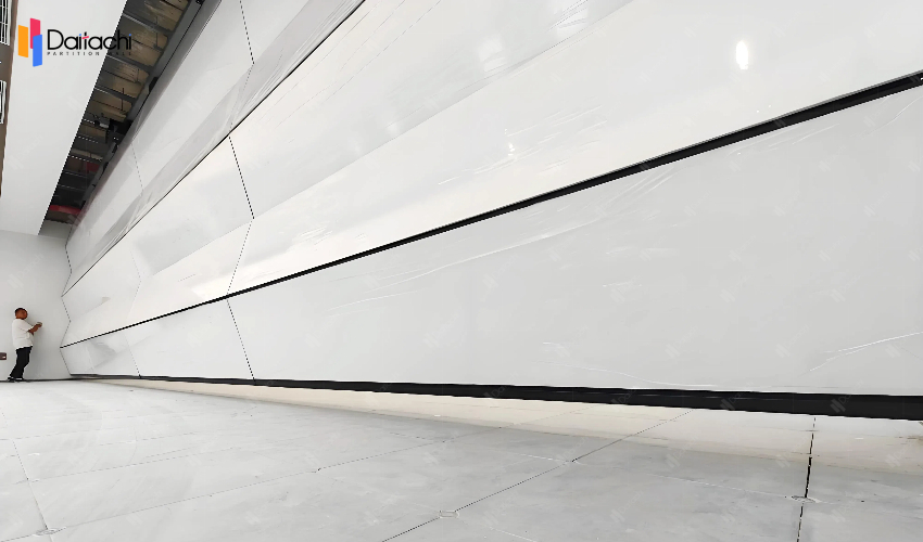 extra large off-white vertical folding lifting wall in the open area extra large off-white vertical folding lifting wall in the open area