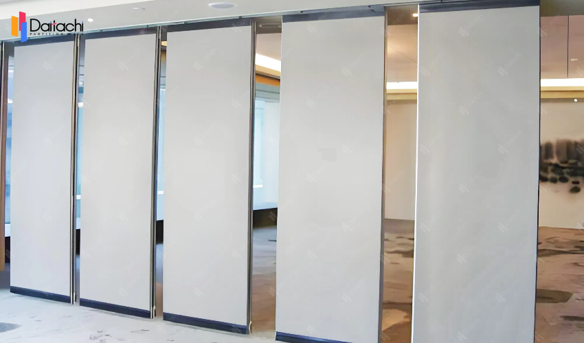White manual movable partition wall in the vacant space White manual movable partition wall in the vacant space