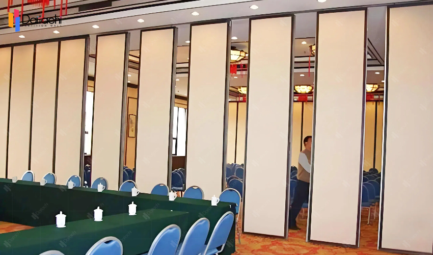 Beige manual movable partition wall in the conference room