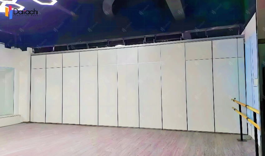 White minimalist activity partition wall in the dance studio