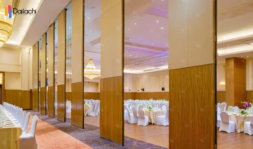 Light wood color manual movable partition wall in the dining area Light wood color manual movable partition wall in the dining area