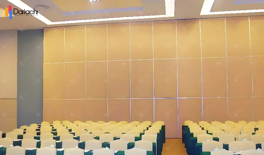 White chairs and green tables with beige movable partition walls White chairs and green tables with beige movable partition walls
