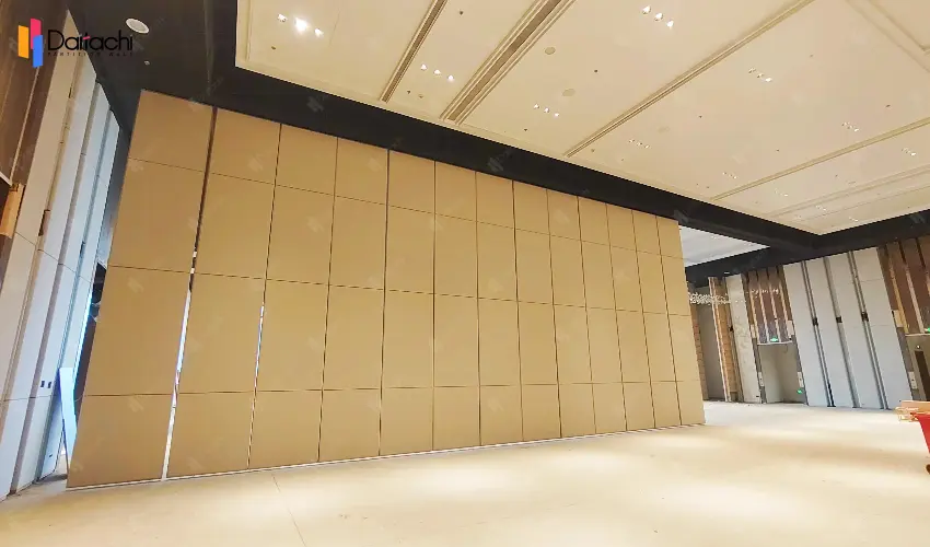 The hotel lobby features a large, light-colored, manually movable partition wall. The hotel lobby features a large, light-colored, manually movable partition wall.