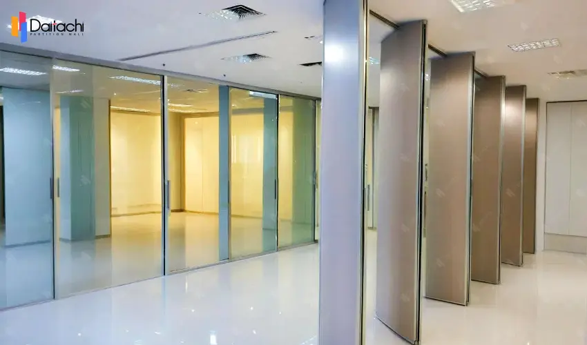 Gray manual movable partition wall inside the company's glass door