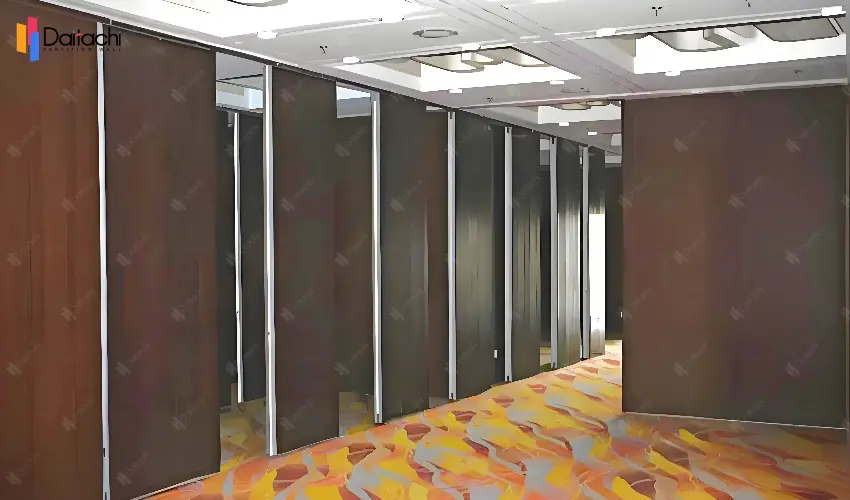 Reddish brown movable partition wall system in a blue and orange carpet room Reddish brown movable partition wall system in a blue and orange carpet room