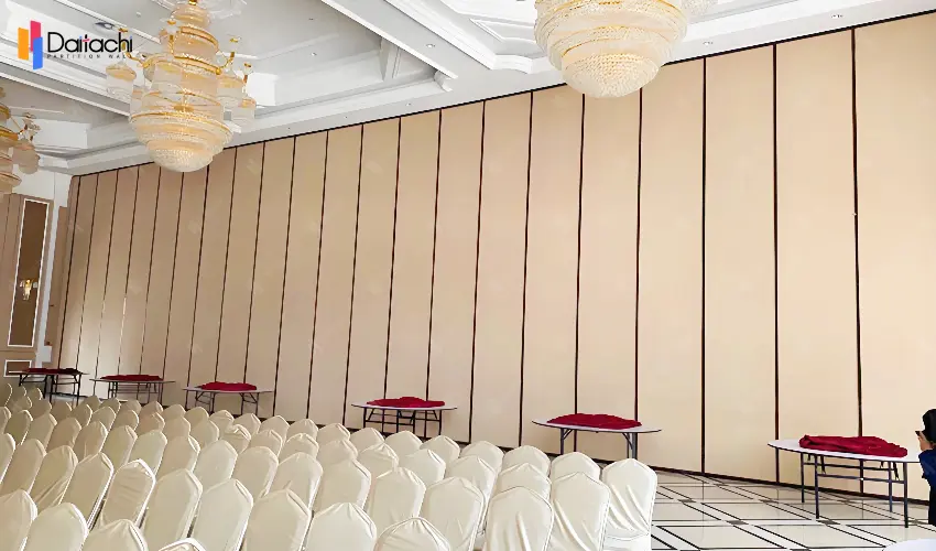 A large area of white paired with a lower section of brown manually movable partition wall A large area of white paired with a lower section of brown manually movable partition wall