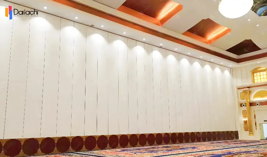 A large area of white paired with a lower section of brown manually movable partition wall A large area of white paired with a lower section of brown manually movable partition wall